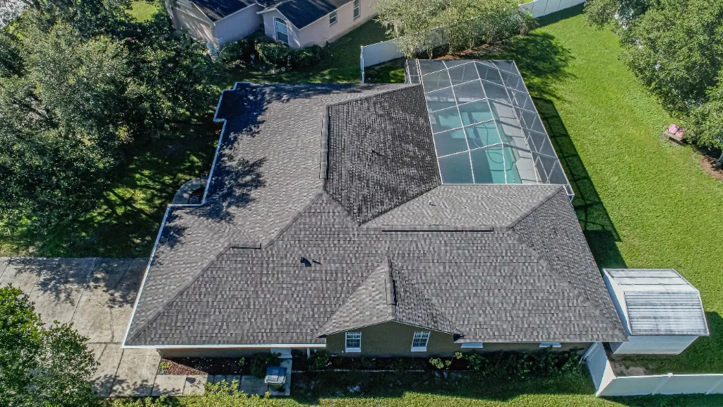 Aerial view of a completed Stronghold Roofing architectural shingle roof replacement on a Florida ranch-style home