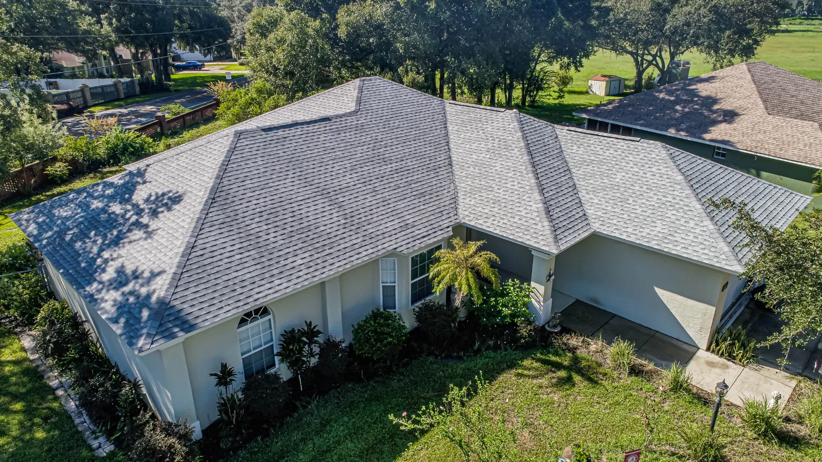 Aerial view of a Stronghold charcoal architectural shingle roof on a two-story Florida home