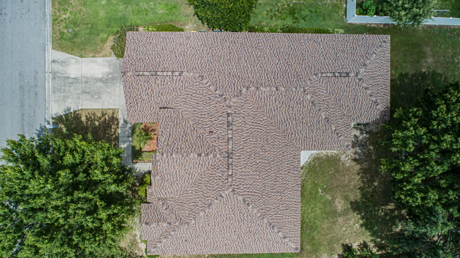 Aerial view of a Stronghold charcoal architectural shingle roof with multi-gable layout