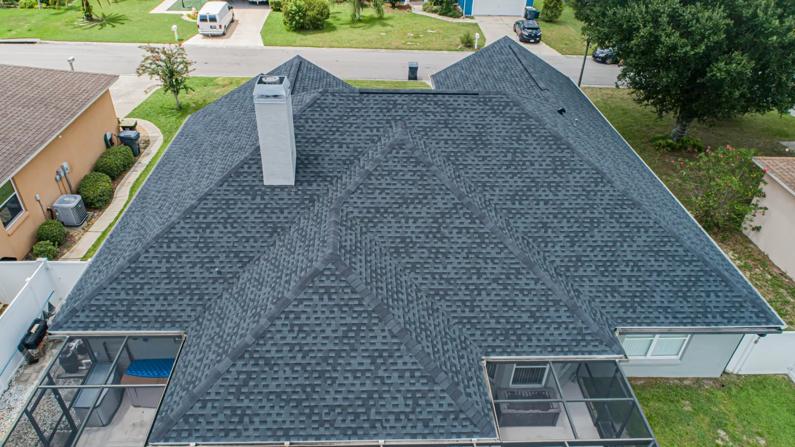 Aerial view of a completed Stronghold charcoal architectural shingle roof on a Florida home