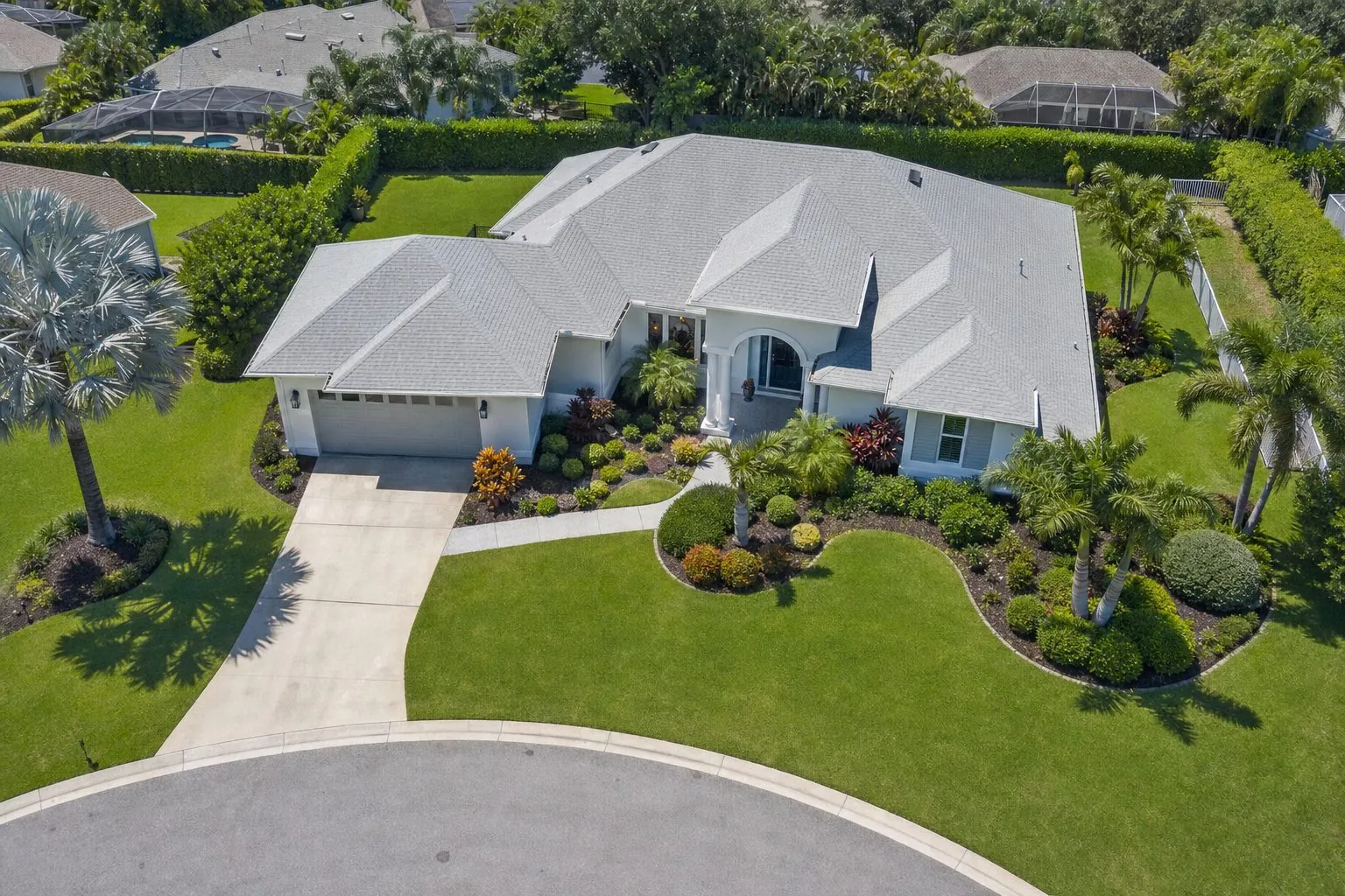 Aerial drone view of a completed Stronghold Roofing shingle roof replacement in Florida