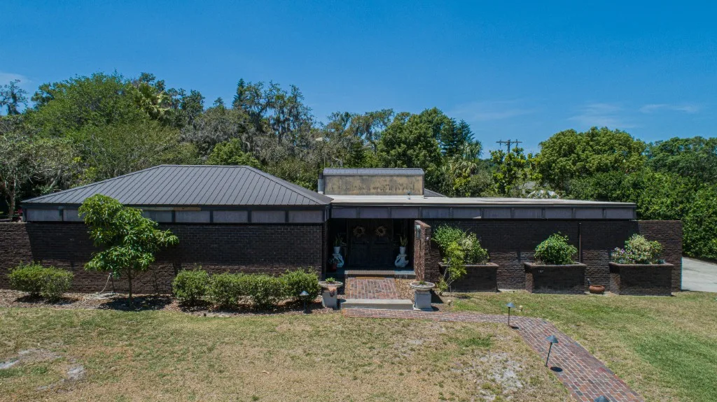 Stronghold Roofing installed a charcoal metal roof on this commercial building in Brandon, FL.