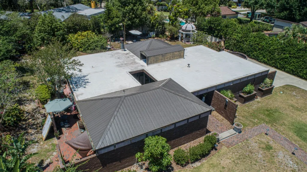 Stronghold Roofing installed a dark gray metal roof on this commercial building in Tampa, FL.