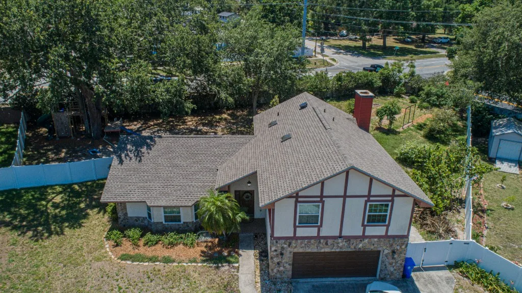Stronghold Roofing installed a gray shingle roof on this two-story home in Cape Coral, FL.