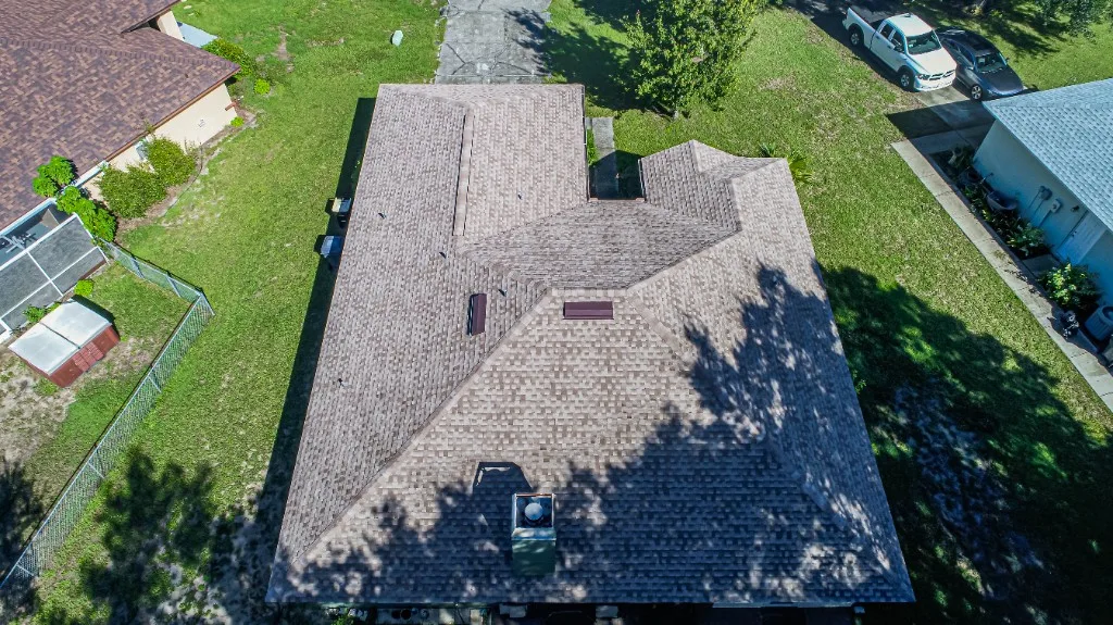 Stronghold Roofing completed a tan shingle roof with a skylight in Cape Coral, FL.