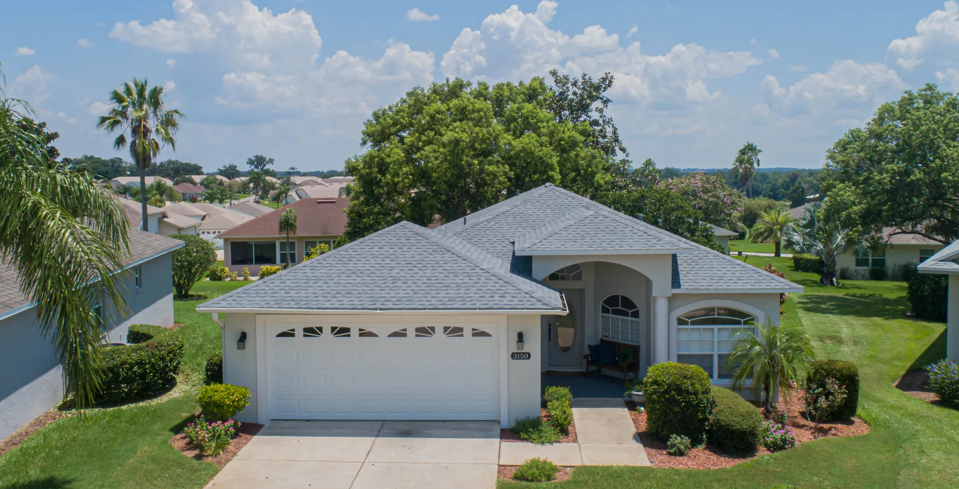 Stronghold Roofing installed a gray shingle roof on a ranch-style home in Lakeland, FL.