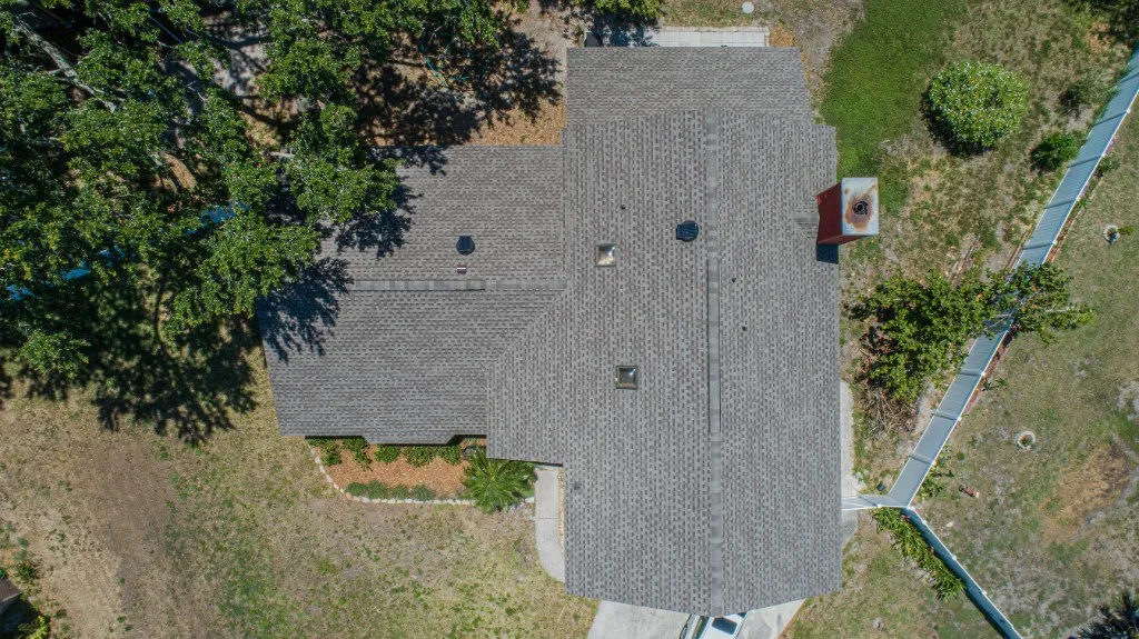 Stronghold Roofing installed a gray shingle roof with skylights in Naples, FL.
