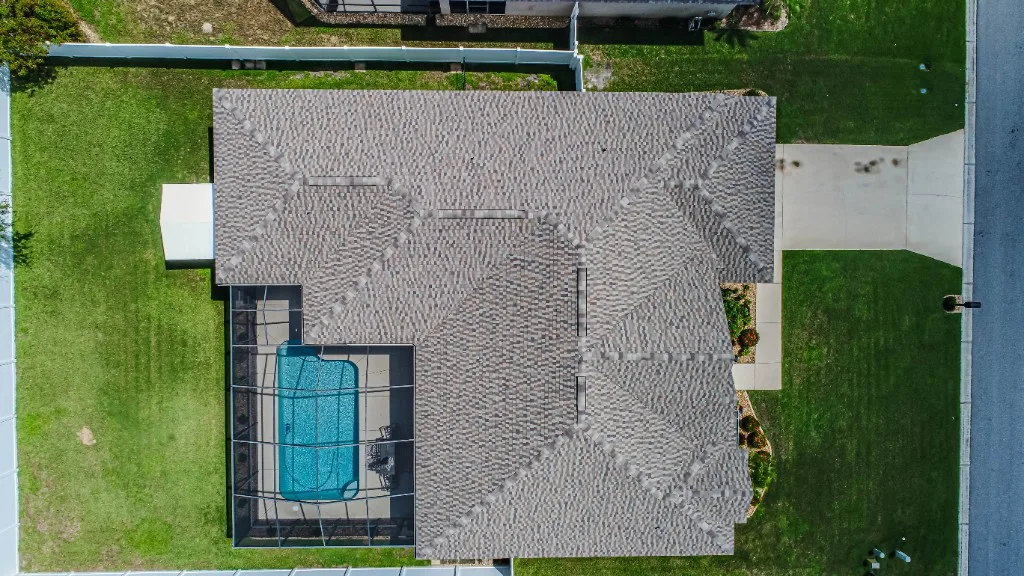 Stronghold Roofing completed a gray shingle roof with a screened pool cage in Winter Haven, FL.