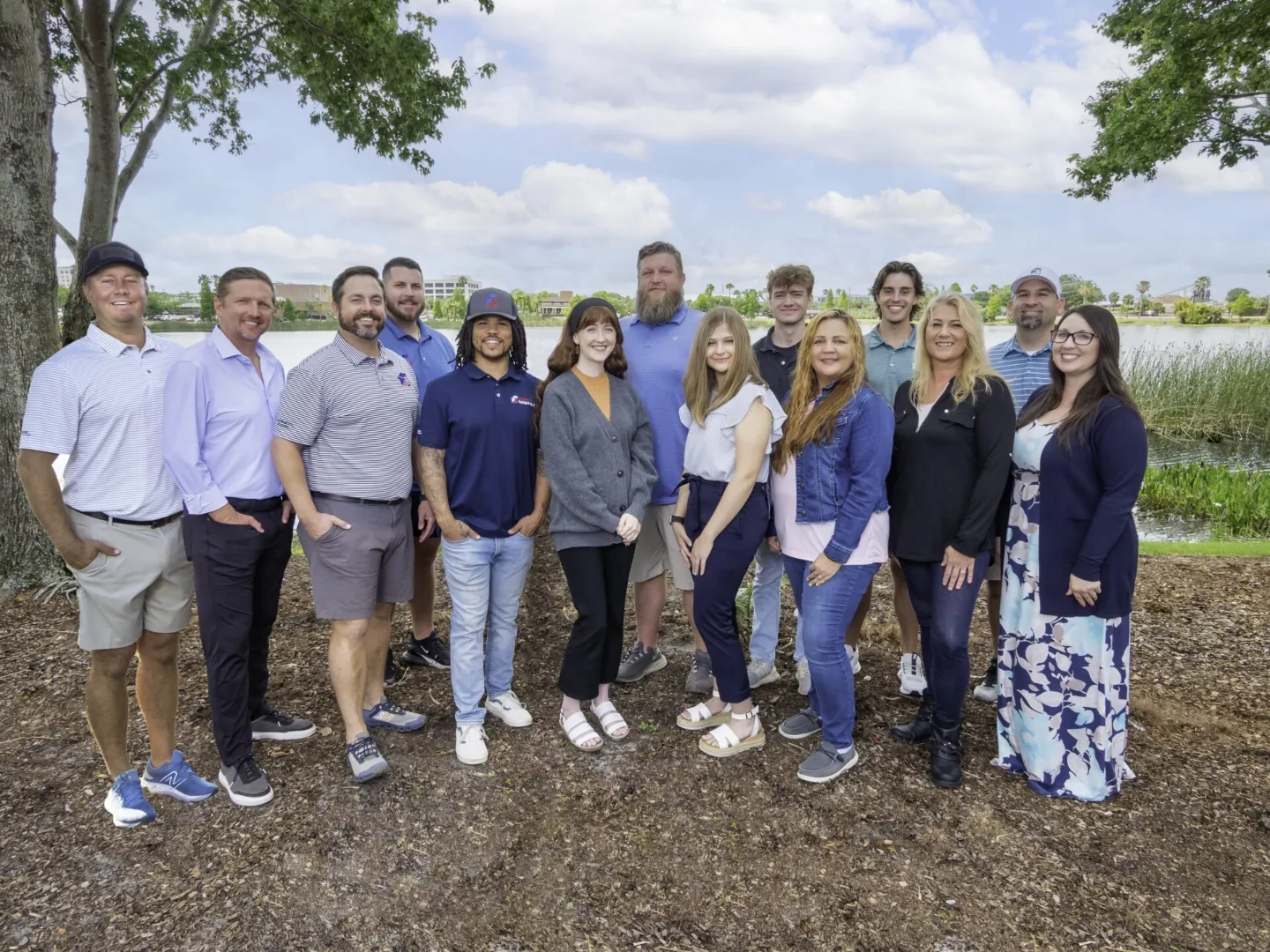 The Stronghold Roofing team together by the lake