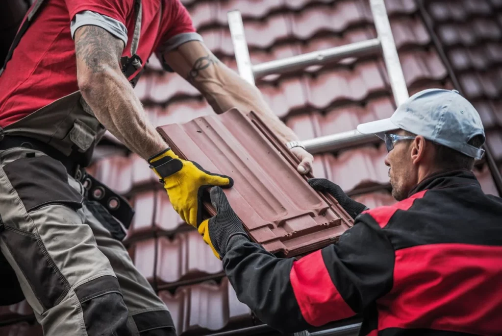 2 roofer using tiles for roof replacement in Lakeland