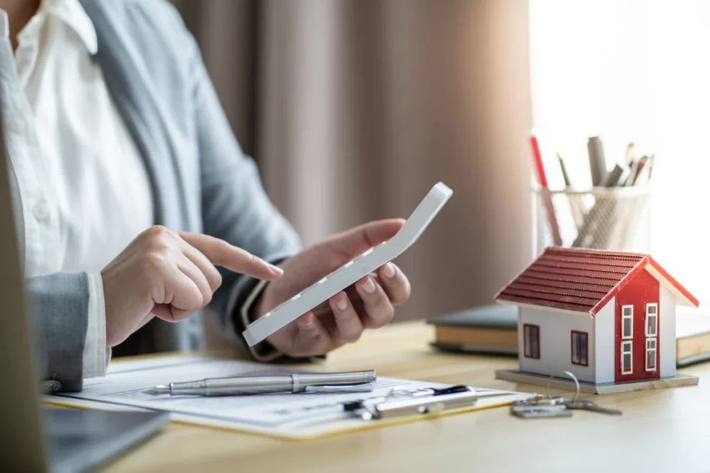 a woman calculating roof cost