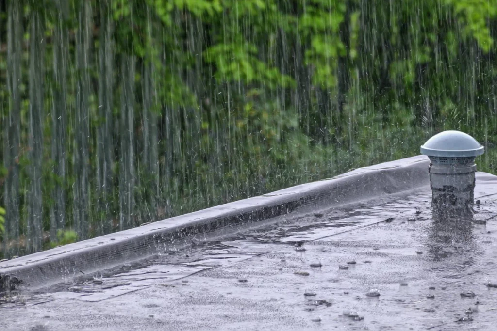 Rainwater streams pour on the roof of the building in Lakeland