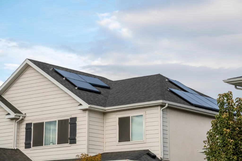 Upper part exterior of a two storey house with solar panels